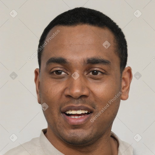 Joyful black young-adult male with short  black hair and brown eyes