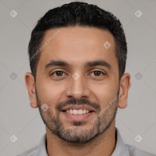 Joyful white young-adult male with short  black hair and brown eyes