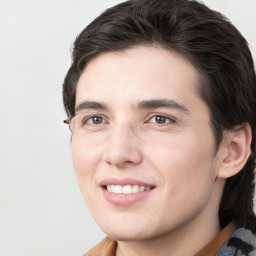 Joyful white young-adult male with medium  brown hair and brown eyes