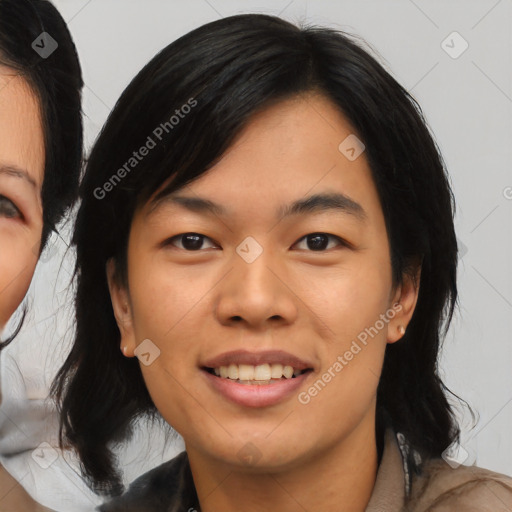 Joyful asian young-adult female with medium  black hair and brown eyes