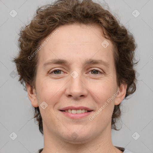 Joyful white adult female with short  brown hair and grey eyes