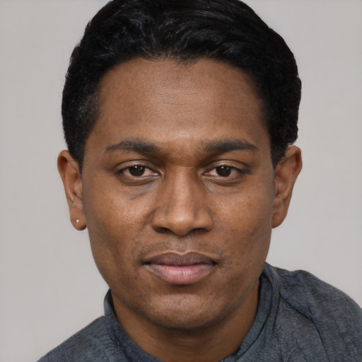 Joyful asian adult male with short  black hair and brown eyes