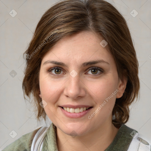 Joyful white young-adult female with medium  brown hair and green eyes