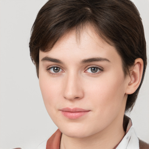 Neutral white young-adult female with short  brown hair and brown eyes