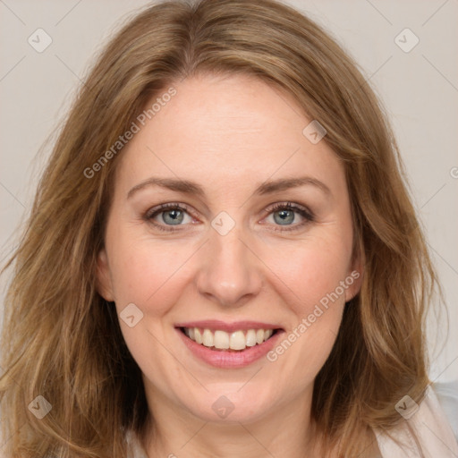 Joyful white young-adult female with long  brown hair and green eyes