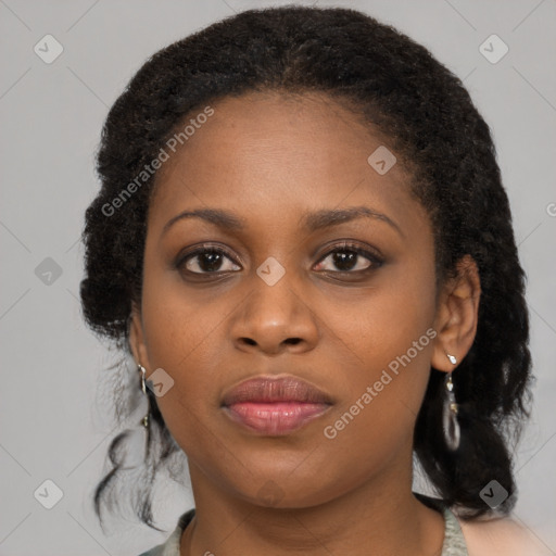 Joyful black young-adult female with medium  brown hair and brown eyes