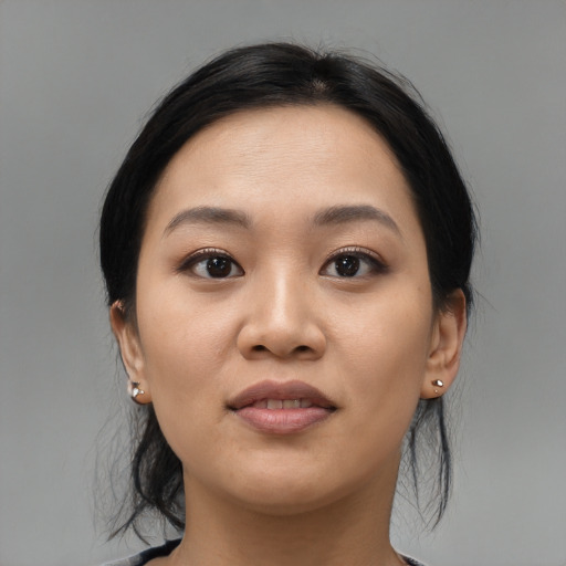 Joyful asian young-adult female with medium  black hair and brown eyes