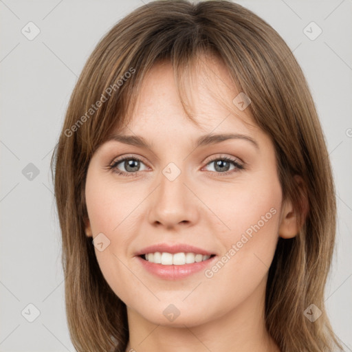 Joyful white young-adult female with long  brown hair and green eyes