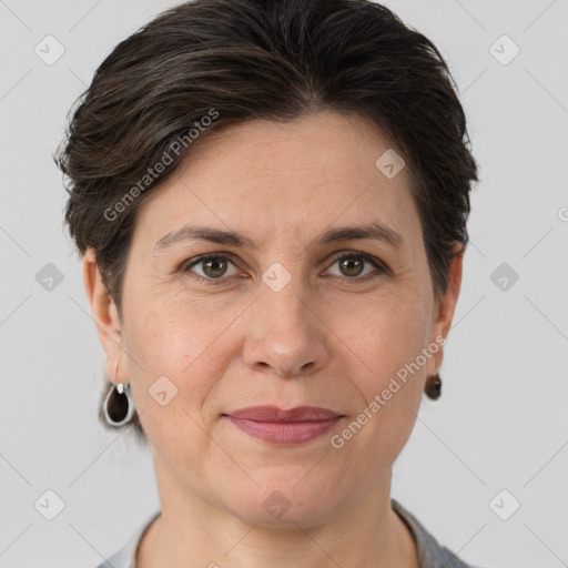 Joyful white adult female with short  brown hair and grey eyes