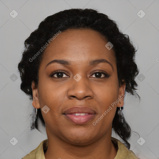 Joyful black adult female with medium  brown hair and brown eyes