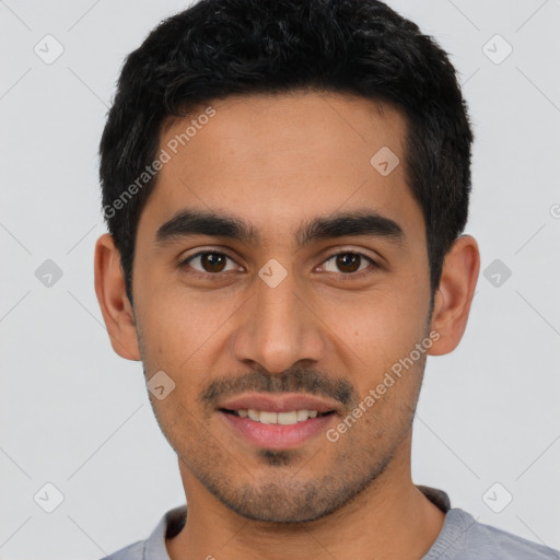 Joyful latino young-adult male with short  black hair and brown eyes