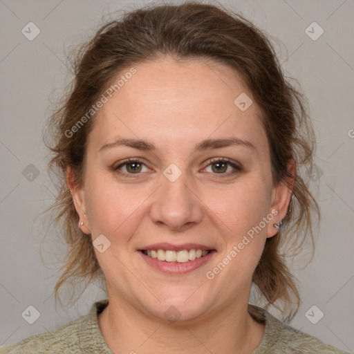 Joyful white adult female with medium  brown hair and grey eyes