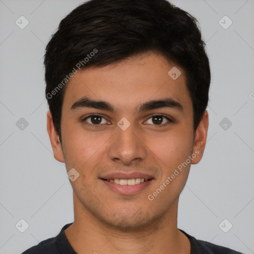 Joyful white young-adult male with short  black hair and brown eyes