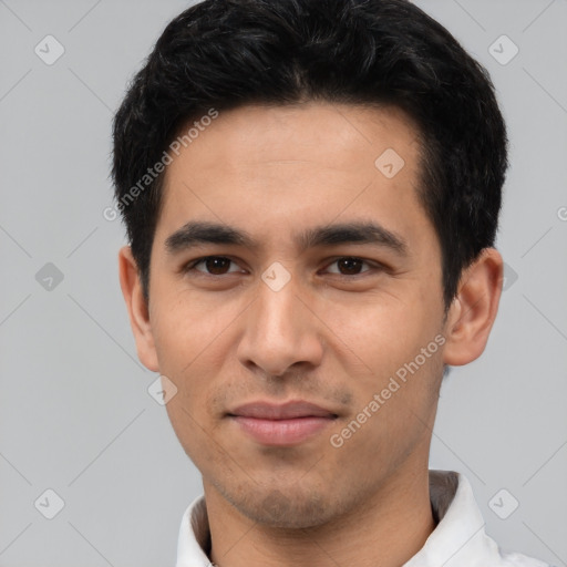 Joyful white young-adult male with short  black hair and brown eyes