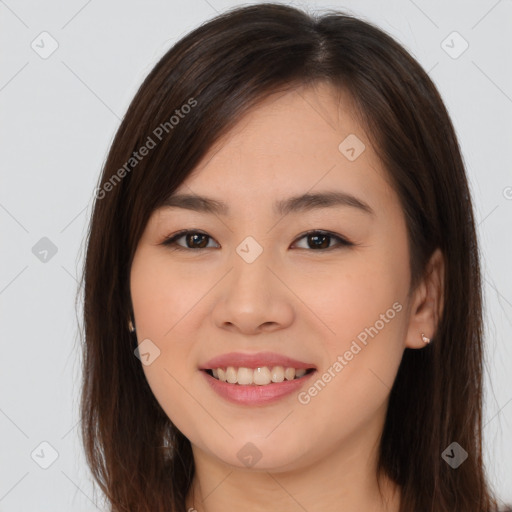 Joyful asian young-adult female with long  brown hair and brown eyes