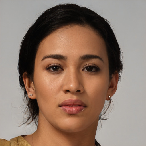 Joyful asian young-adult female with medium  black hair and brown eyes