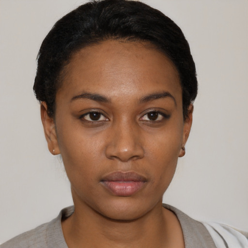 Neutral black young-adult female with short  black hair and brown eyes