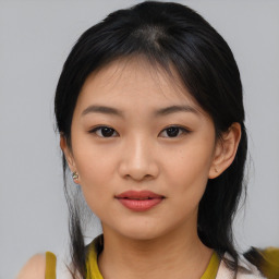 Joyful asian young-adult female with medium  black hair and brown eyes