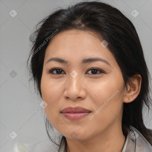 Joyful latino young-adult female with medium  brown hair and brown eyes