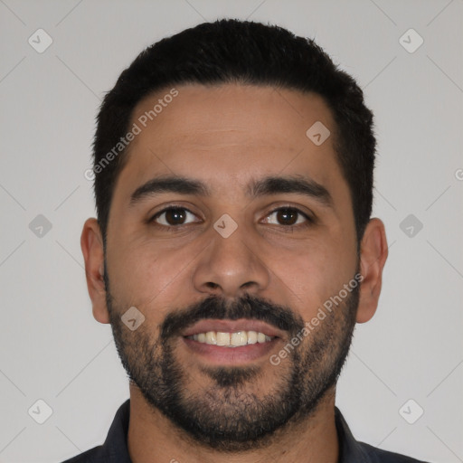 Joyful latino young-adult male with short  black hair and brown eyes