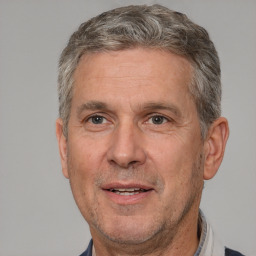 Joyful white middle-aged male with short  brown hair and brown eyes