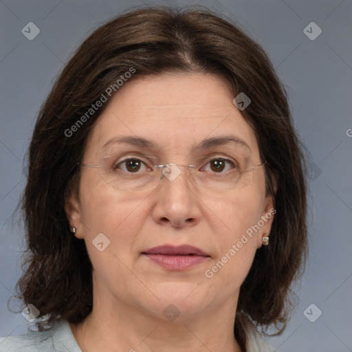 Joyful white adult female with medium  brown hair and brown eyes