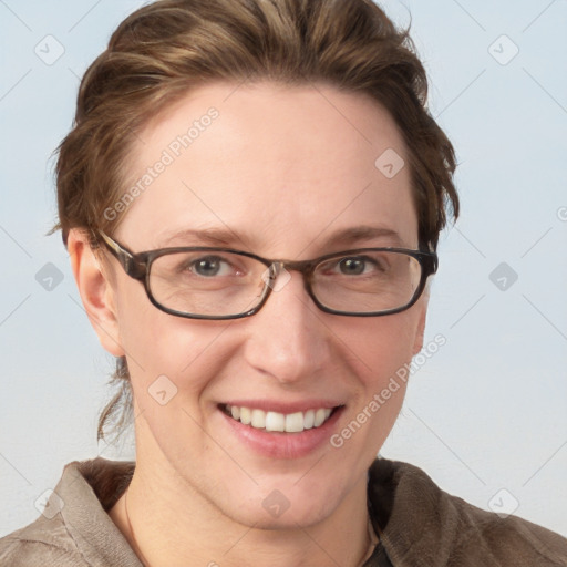 Joyful white adult female with medium  brown hair and blue eyes