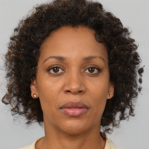 Neutral black adult female with short  brown hair and brown eyes