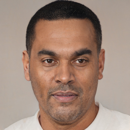 Neutral latino adult male with short  black hair and brown eyes