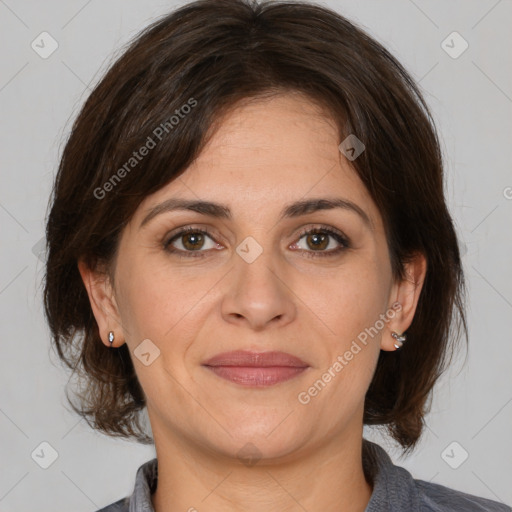 Joyful white adult female with medium  brown hair and brown eyes