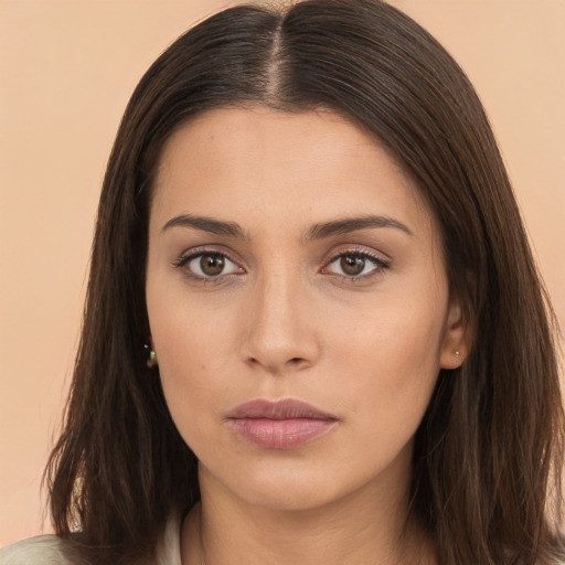 Neutral white young-adult female with long  brown hair and brown eyes