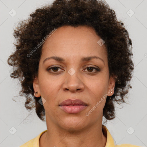 Joyful black adult female with short  brown hair and brown eyes