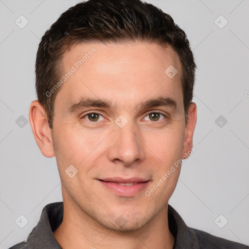 Joyful white young-adult male with short  brown hair and grey eyes