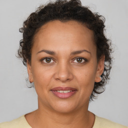 Joyful white adult female with short  brown hair and brown eyes