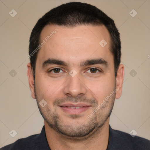 Joyful white young-adult male with short  black hair and brown eyes