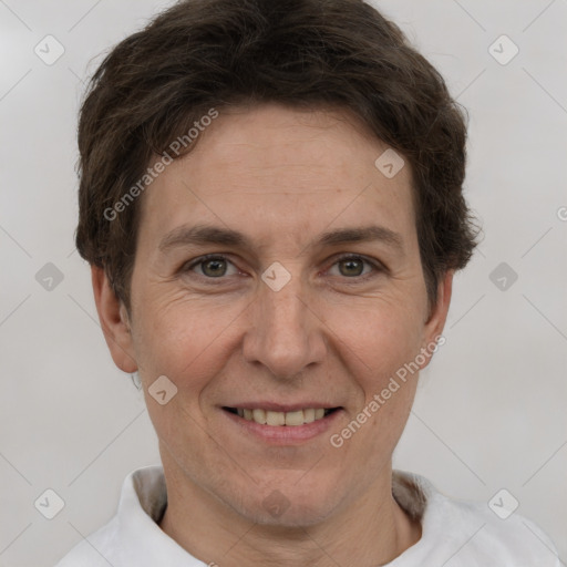 Joyful white adult female with short  brown hair and brown eyes