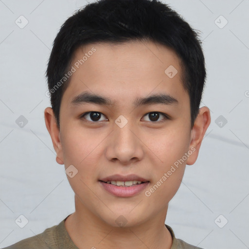 Joyful asian young-adult male with short  brown hair and brown eyes