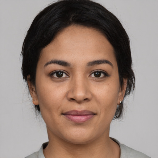 Joyful asian young-adult female with medium  black hair and brown eyes
