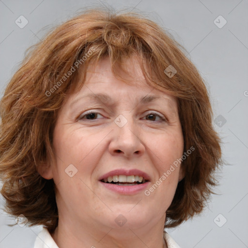 Joyful white adult female with medium  brown hair and blue eyes