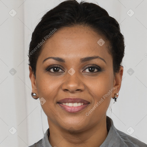 Joyful black young-adult female with short  brown hair and brown eyes