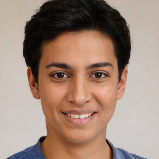 Joyful white young-adult male with short  black hair and brown eyes