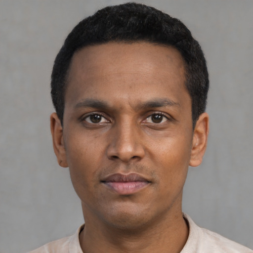 Neutral latino young-adult male with short  black hair and brown eyes