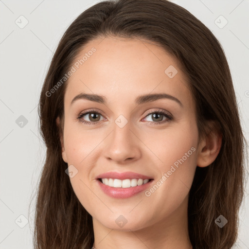 Joyful white young-adult female with long  brown hair and grey eyes