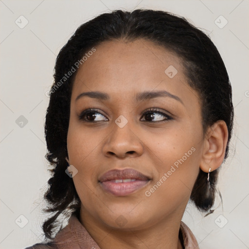 Joyful black young-adult female with medium  brown hair and brown eyes