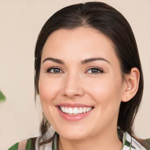 Joyful white young-adult female with medium  brown hair and brown eyes