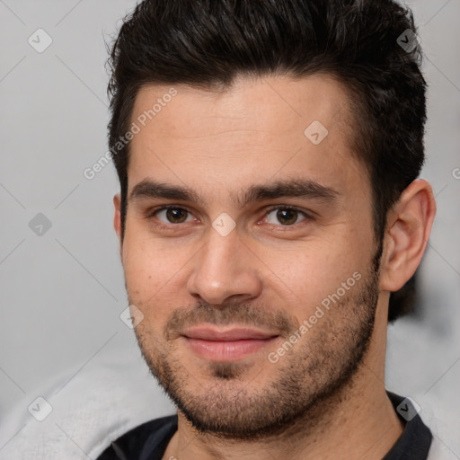 Joyful white young-adult male with short  brown hair and brown eyes