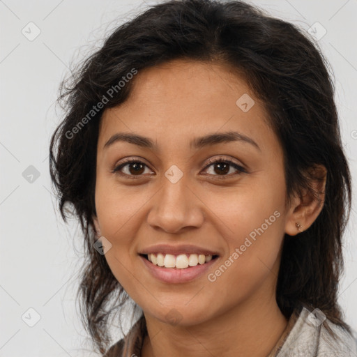 Joyful latino young-adult female with long  brown hair and brown eyes