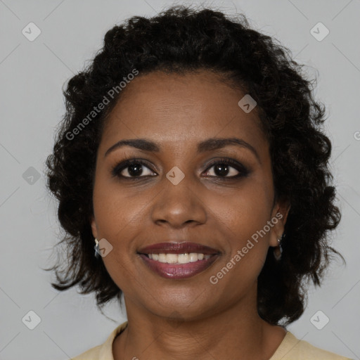 Joyful black young-adult female with medium  brown hair and brown eyes