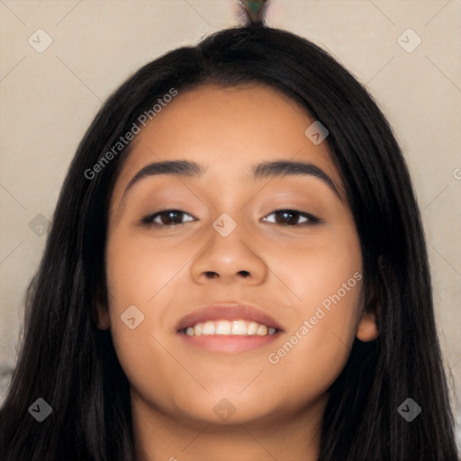 Joyful latino young-adult female with long  black hair and brown eyes