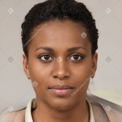 Joyful black young-adult female with short  brown hair and brown eyes